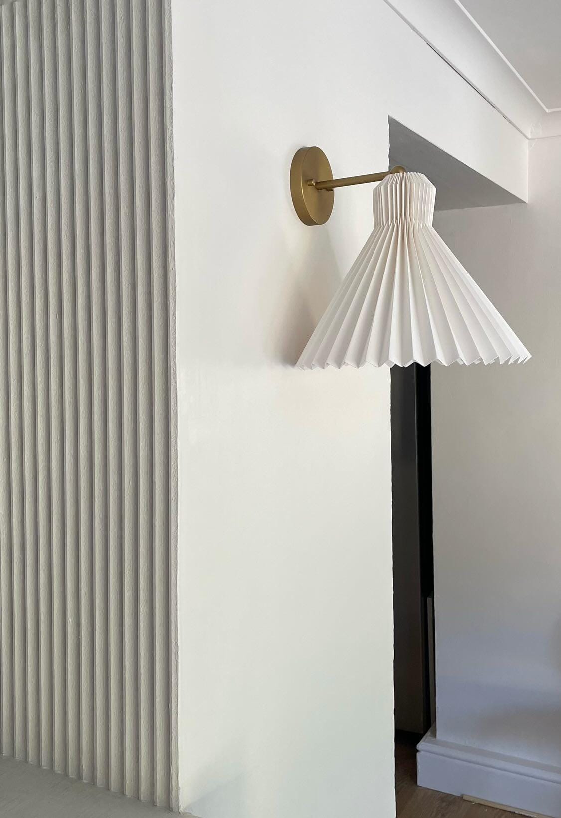 Wall panelling with a wall lamp