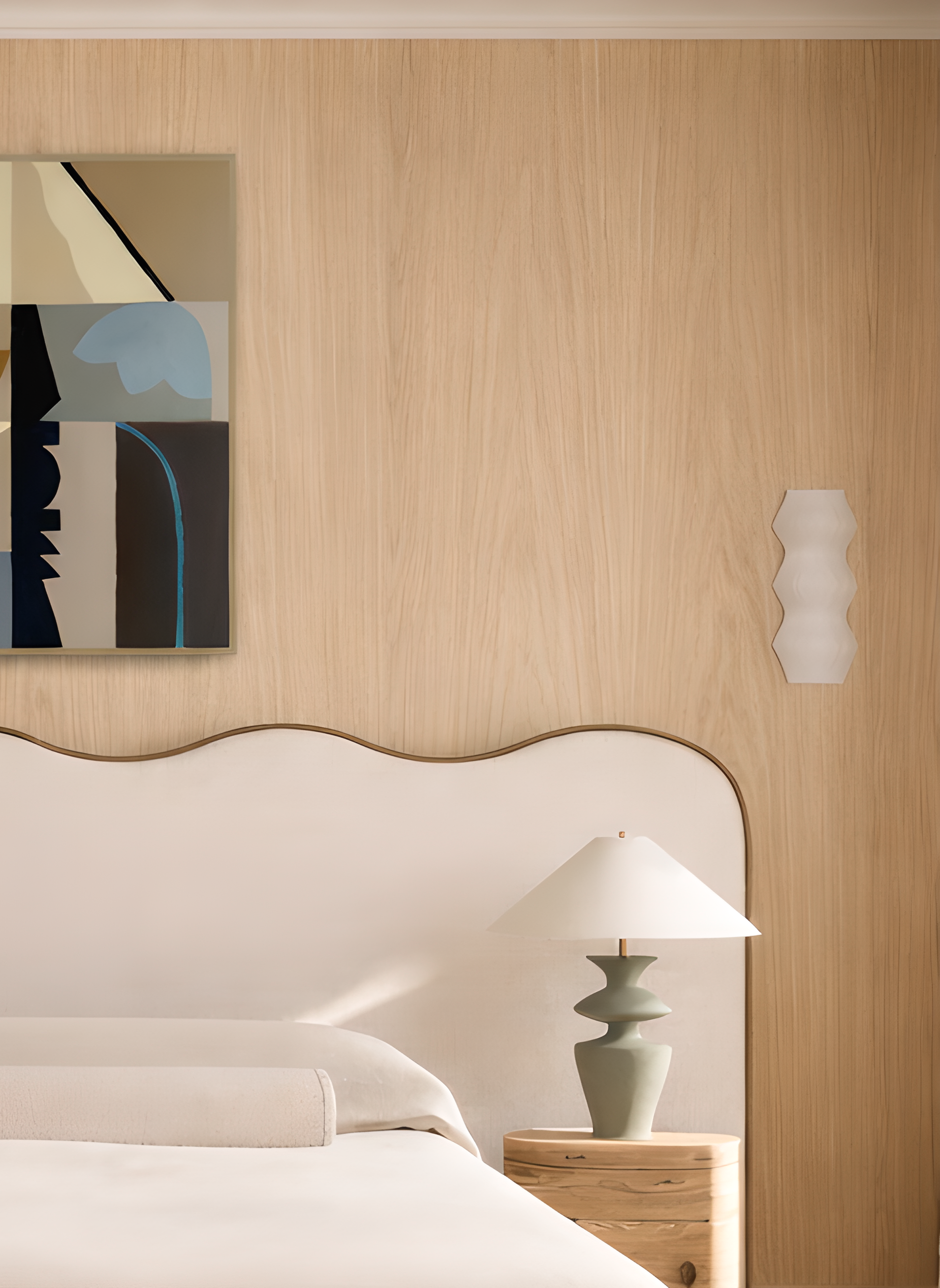 Modern bedroom with oak panelling, abstract painting, and lamp.