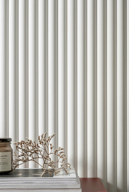 Decorative object on a surface with a ribbed wall panelling background