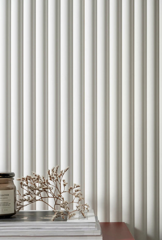 Decorative object on a surface with a ribbed wall panelling background